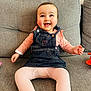 Margot participe au concours pour gagner de l'argent avec cette photo : baby, infant, smile, overalls, denim, pink_tights, couch, sofa, rosy_cheeks, happy, sitting, living_room, textured_wall, cute, portrait, small_hand, legs, plush_toy, eyes, child
