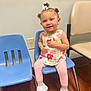 Ariyah joined the competition — help win amazing prizes! blue_chair, casual_clothing, child, curly_hair, cute, earrings, floral_top, hair_bows, happy, indoor, person, pink_leggings, plastic_chair, portrait, sitting, smile, toddler, white_sneakers, wooden_floor, young_child