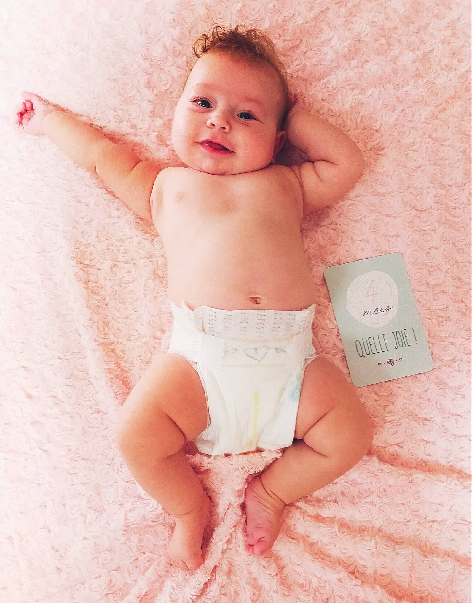Shanna participe au concours pour gagner de l'argent avec cette photo : arm, baby, baby_toddler_clothing, chest, eye, finger, gesture, hand, happy, human_body, joint, knee, muscle, neck, person, pink, skin, smile, stomach, thigh