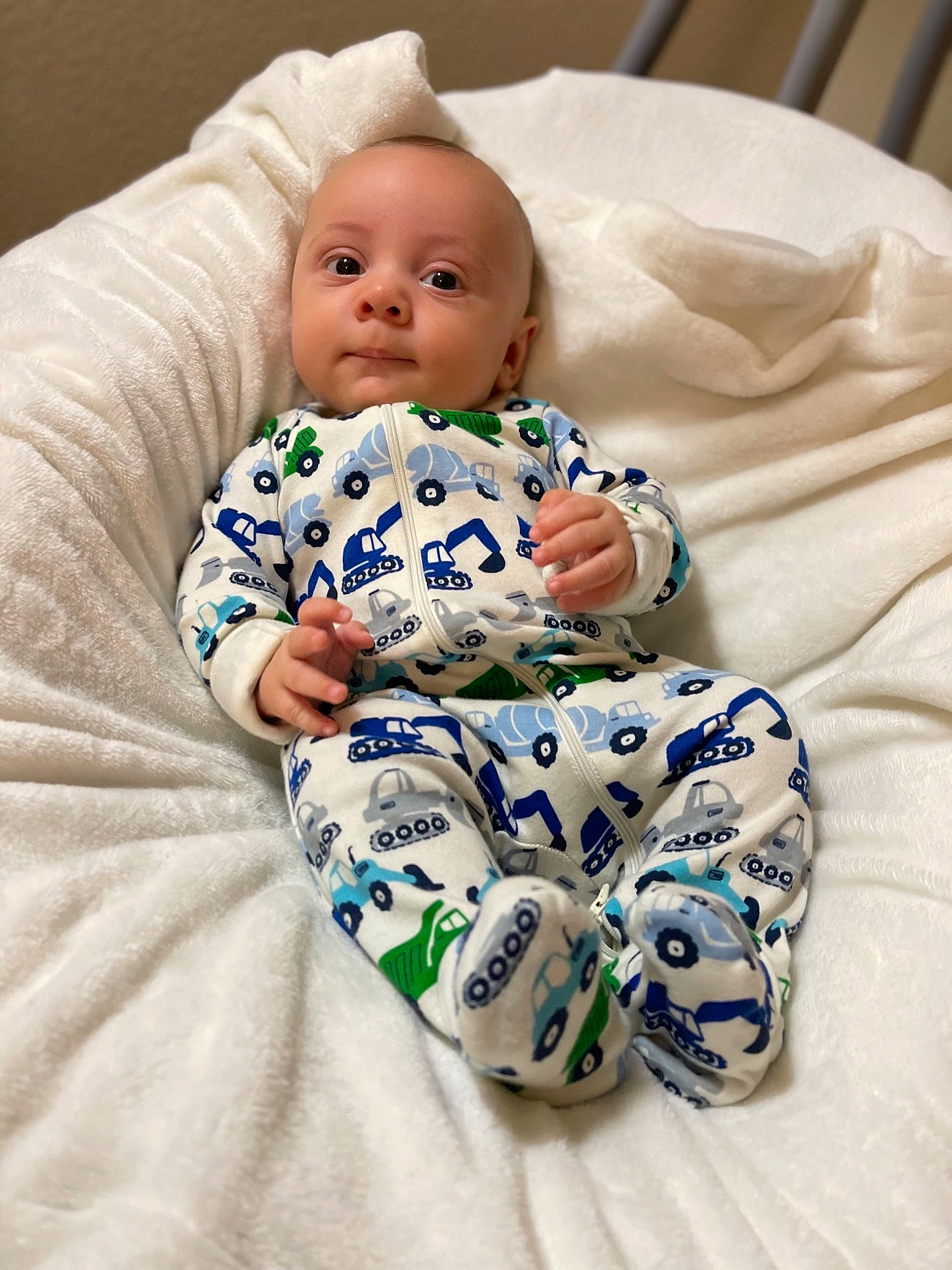 Haiden is registered to the contest to win money with this photo: baby, baby_products, baby_toddler_clothing, cheek, child, collar, comfort, face, happy, head, human_body, linens, pattern, person, portrait_photography, room, sitting, sleeve, t_shirt, textile