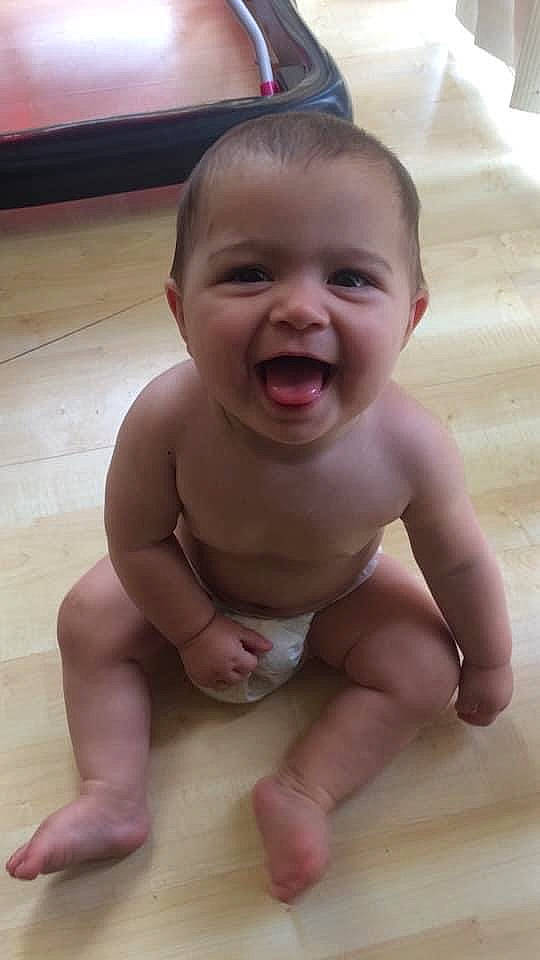 Harper joined the competition — help win amazing prizes! baby, baby_making_funny_faces, cheek, child, chin, crawling, face, facial_expression, forehead, fun, head, laugh, lip, mouth, neck, nose, person, sitting, skin, smile