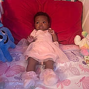 Cimani joined the competition — help win amazing prizes! baby, infant, bed, pillow, pink_dress, booties, plush_toy, stuffed_animal, butterfly_pattern, crib, child, toddler, soft_toys, sleeping_area, room, cute, portrait, indoor, laying_down, expression