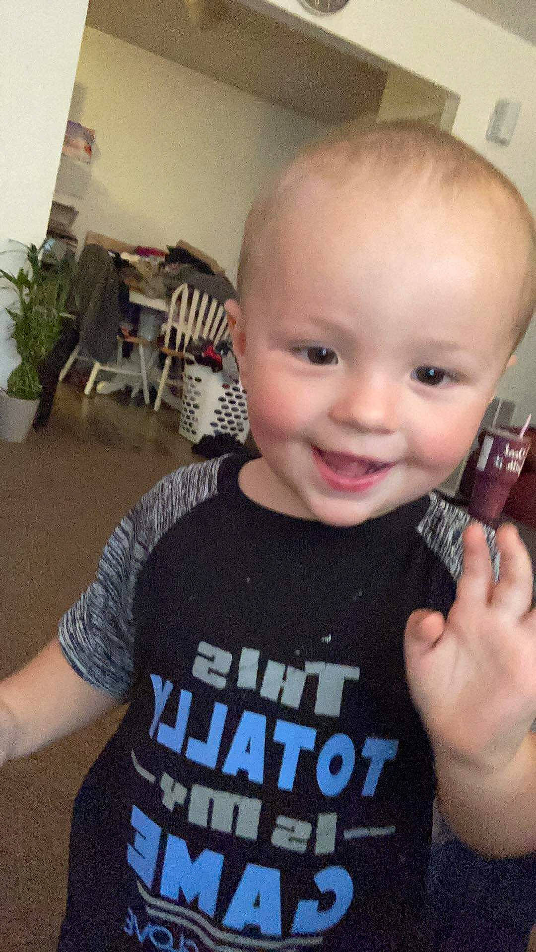 Karson is registered to the contest to win money with this photo: arm, cheek, chin, ear, eye, eyebrow, eyelash, flowerpot, forehead, hairstyle, hand, houseplant, joint, joy, lip, mouth, nose, person, plant, skin