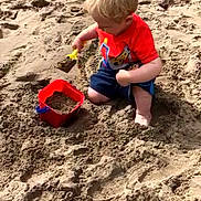 Jayden is registered to the contest to win money with this photo: beach, child, fun, material, mud, outdoor_play_equipment, play, playground, recreation, sand, sandpit, soil, toddler, vacation