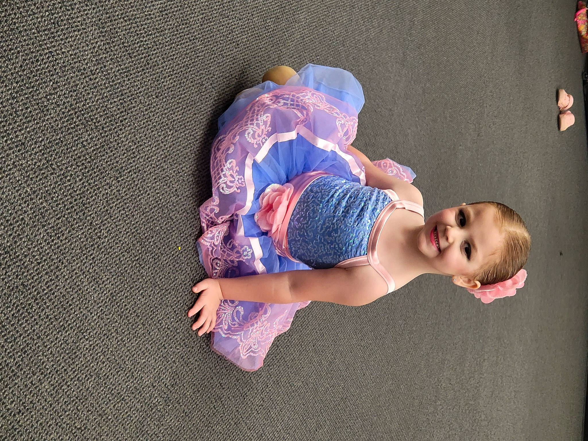 Aurora is registered to the contest to win money with this photo: baby, baby_toddler_clothing, child, comfort, elbow, electric_blue, flash_photography, flooring, fun, happy, human_leg, joy, knee, magenta, pattern, person, purple, sock, textile, thigh