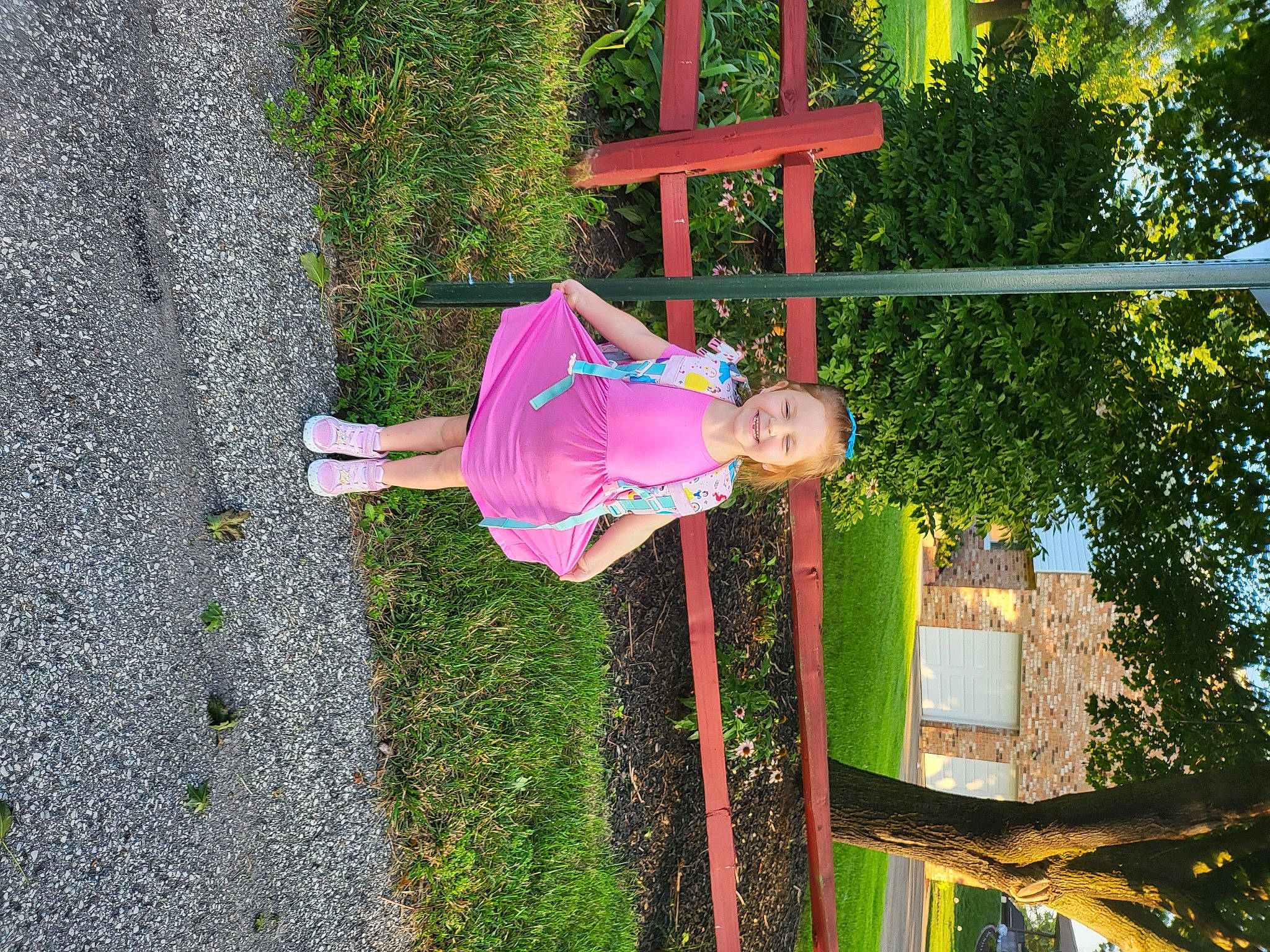 Aurora is registered to the contest to win money with this photo: baby_toddler_clothing, child, city, fun, grass, happy, hat, joy, leisure, magenta, outdoor_play_equipment, people_in_nature, person, plant, playground, pole, recreation, smile, toddler, tree