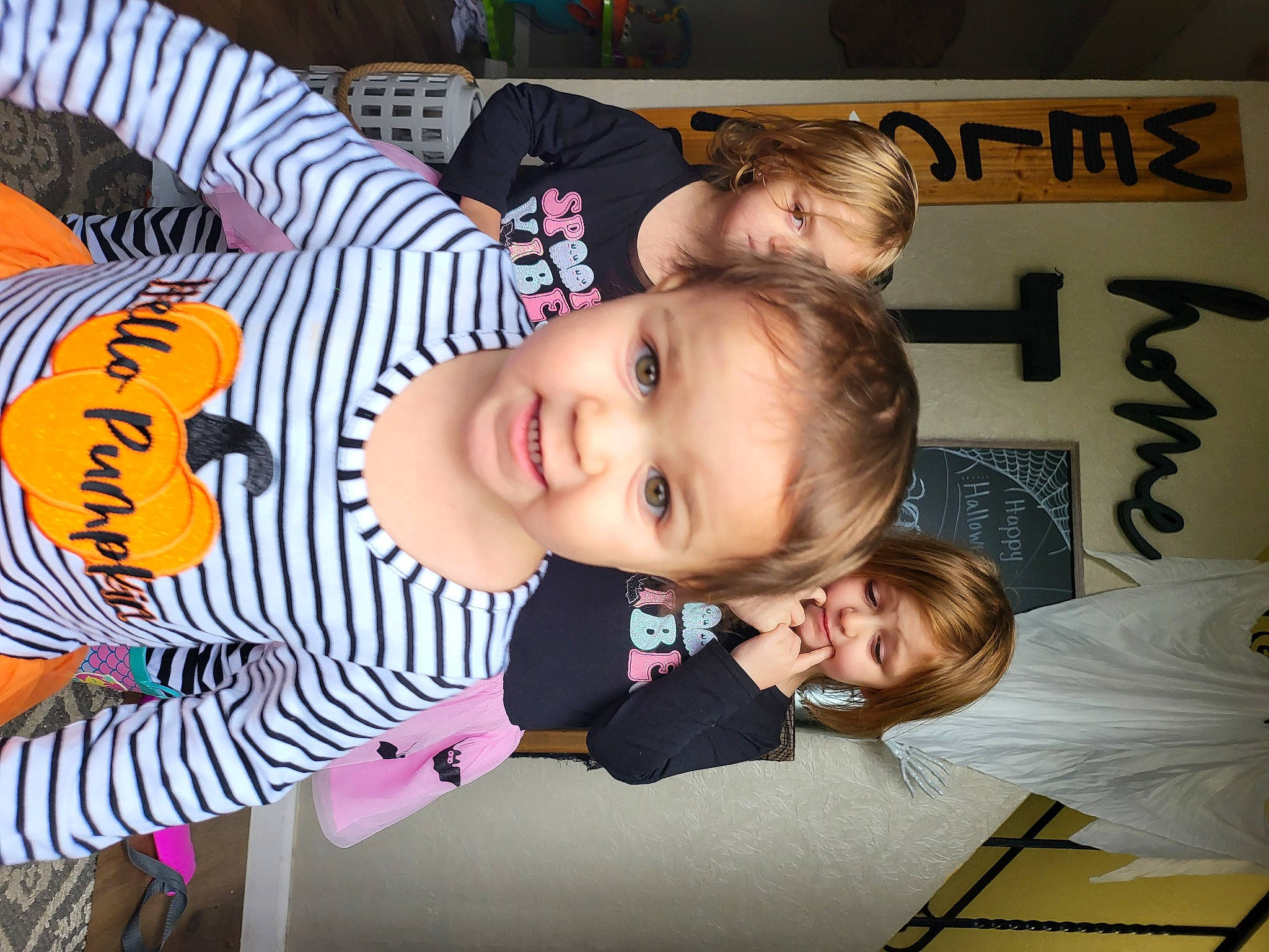 Hazel is registered to the contest to win money with this photo: baby, baby_toddler_clothing, cheek, child, facial_expression, fun, hairstyle, happy, head, pattern, person, product, room, sleeve, smile, suit, toddler, wood