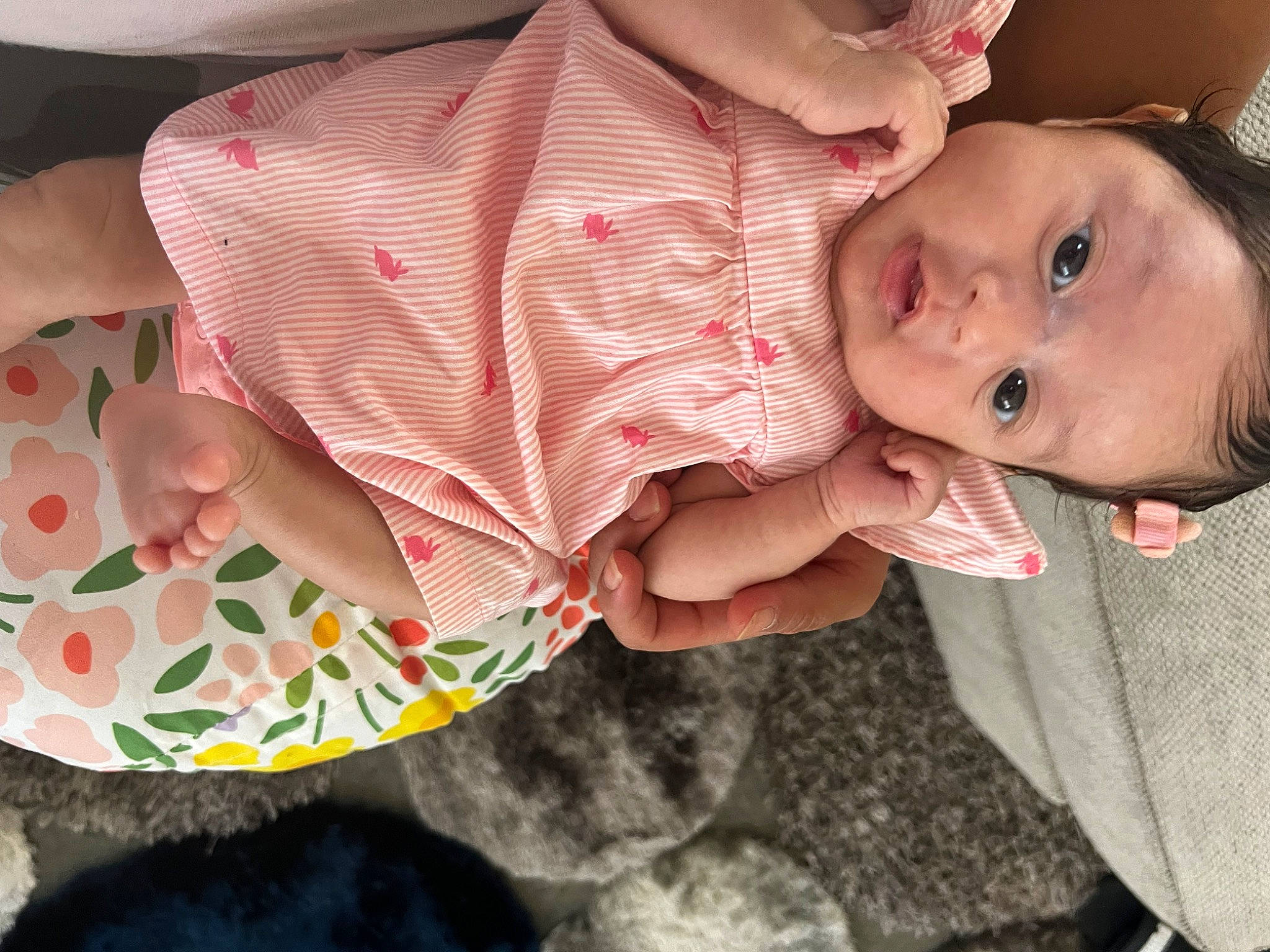 Dailene is registered to the contest to win money with this photo: abdomen, baby, baby_products, baby_toddler_clothing, chest, child, finger, fun, gesture, hand, happy, human_leg, linens, mouth, nail, pattern, person, sitting, skin, thumb