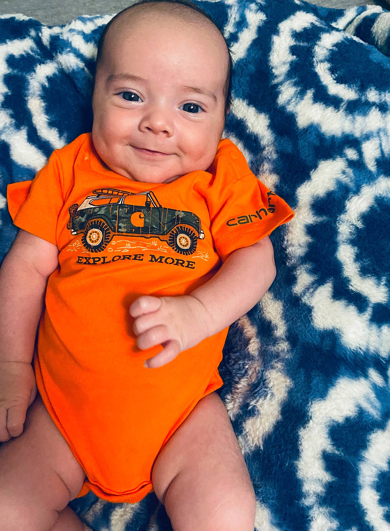 Rayden joined the competition — help win amazing prizes! baby, baby_toddler_clothing, cheek, eye, finger, happy, human_body, nose, orange, outerwear, pattern, person, skin, sleeve, smile, stomach, t_shirt, textile, thigh, toddler