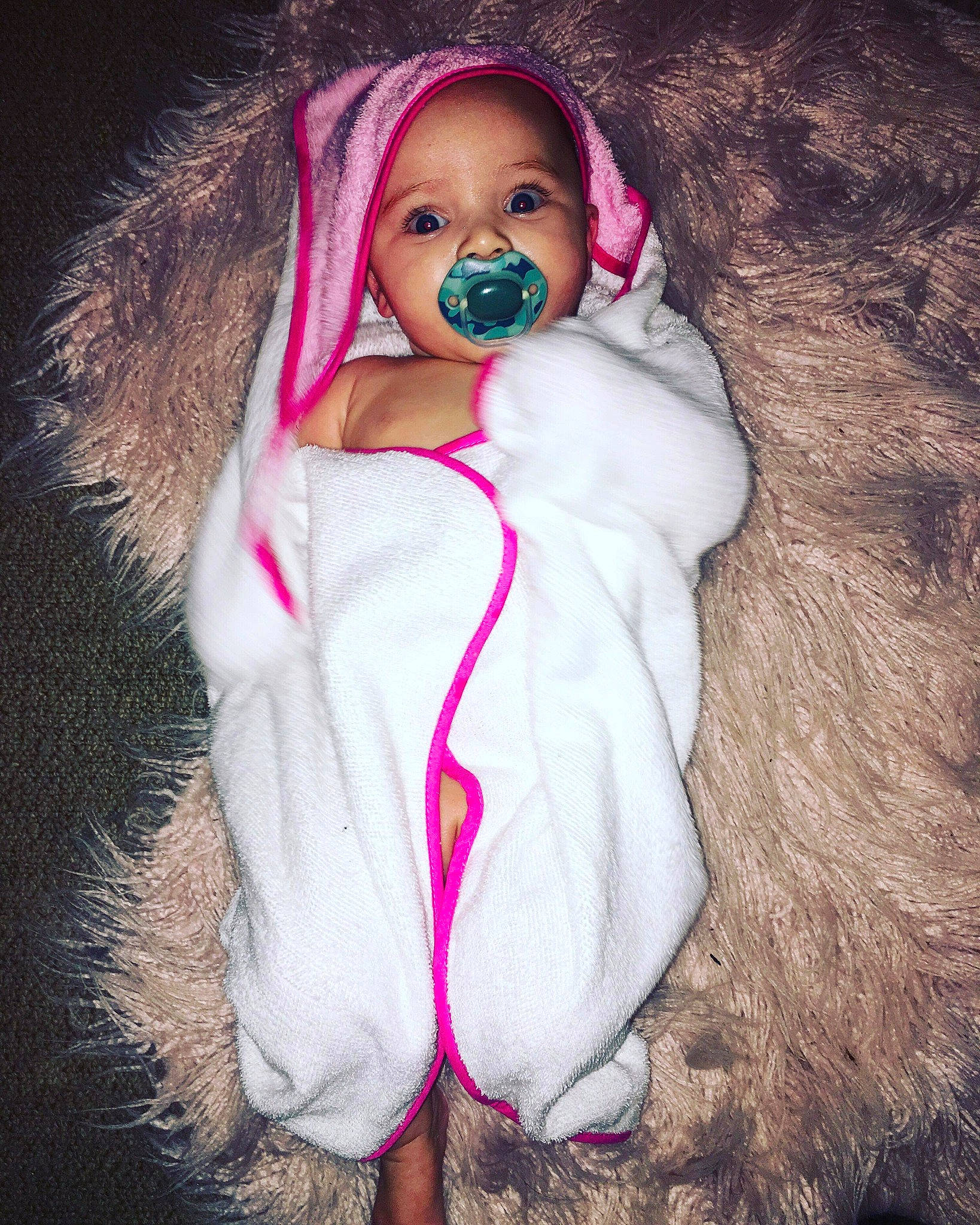 Mahlani is registered to the contest to win money with this photo: audio_equipment, child, costume, ear, electronic_device, fur, fur_clothing, lip, outerwear, person, photography, pink, smile, toddler