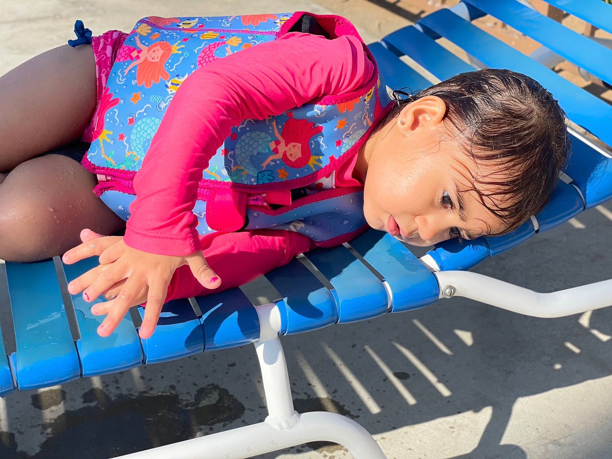 Bella joined the competition — help win amazing prizes! azure, blue, child, comfort, elbow, electric_blue, fun, human_body, human_leg, lap, leisure, outdoor_furniture, person, play, recreation, red, sitting, thigh, toddler, travel