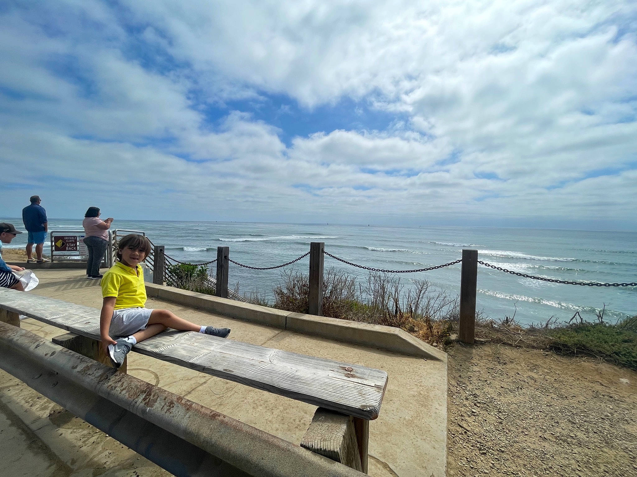 Victor joined the competition — help win amazing prizes! beach, boardwalk, cloud, cumulus, dock, fence, handrail, headwear, horizon, lake, landscape, leisure, person, reservoir, rock, roof, shorts, sky, travel, walkway