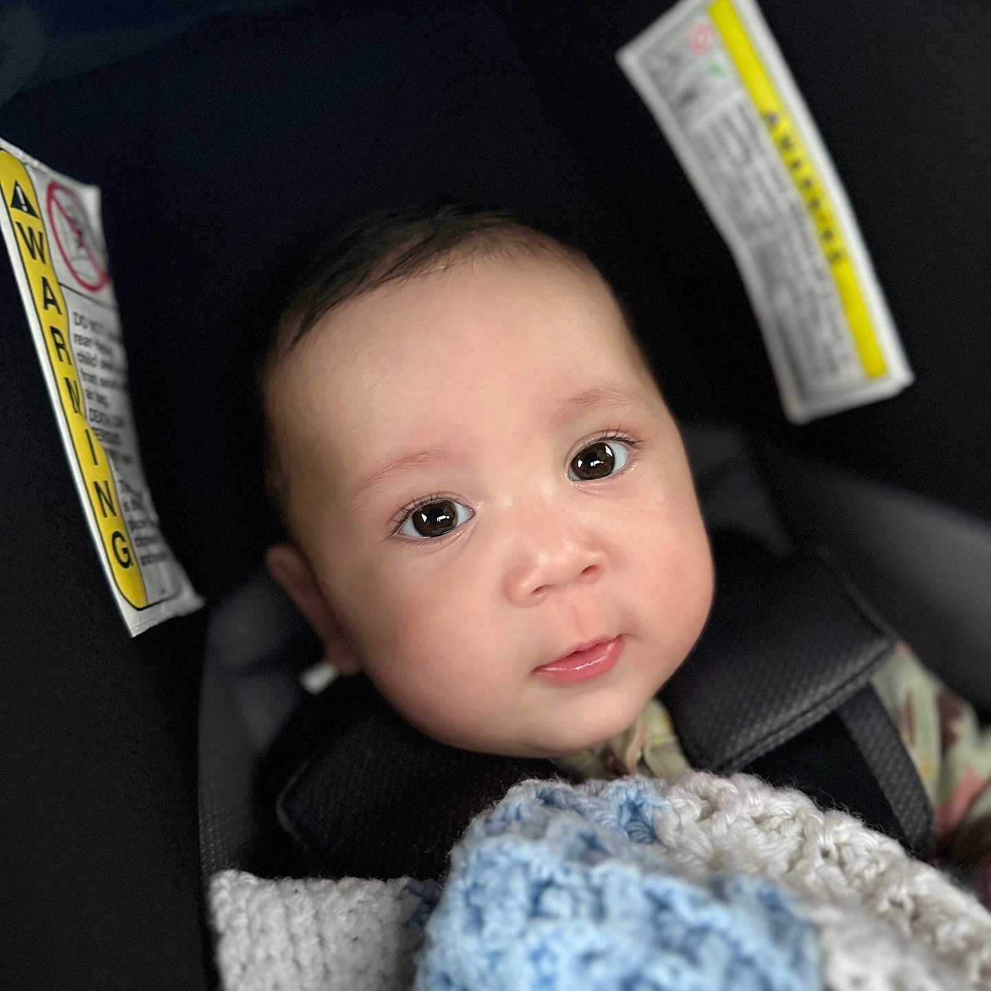 Ismael joined the competition — help win amazing prizes! accessories, baby, blanket, car, car_interior, carseat, clothing, cushion, face, happy, head, homedecor, newborn, person, photography, portrait, smile, text, transportation, vehicle