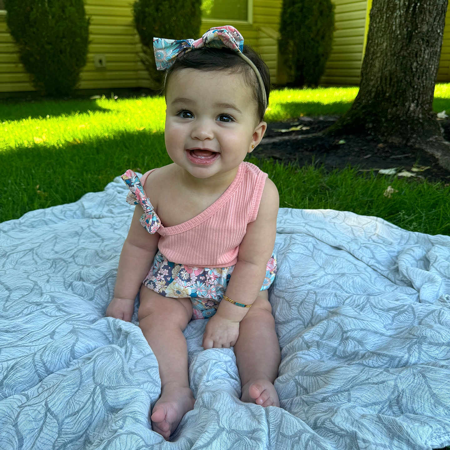 Raya is registered to the contest to win money with this photo: accessories, baby, backyard, clothing, diaper, dress, face, grass, hat, head, lawn, nature, outdoors, person, photography, plant, portrait, summer, tree, yard
