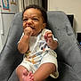 Jaxson joined the competition — help win amazing prizes! baby, child, smiling, sitting, indoor, chair, clothing, cartoon, hand, foot, face, expression, hair, furniture, room, drawing, refrigerator, door, wall, happy