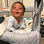 Jaxson is registered to the contest to win money with this photo: baby, smiling, infant, face, clothing, quilted, baby_seat, blanket, toy, happy, indoor, person, cute, child, toddler, fabric, carpet, head, expression, joy