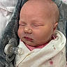 Kyla is registered to the contest to win money with this photo: newborn, baby, sleeping, infant, portrait, face, pacifier, swaddled, blanket, floral_blanket, pink, gray, plush_toy, bedding, indoors, closeup, peaceful, cute, head, photography