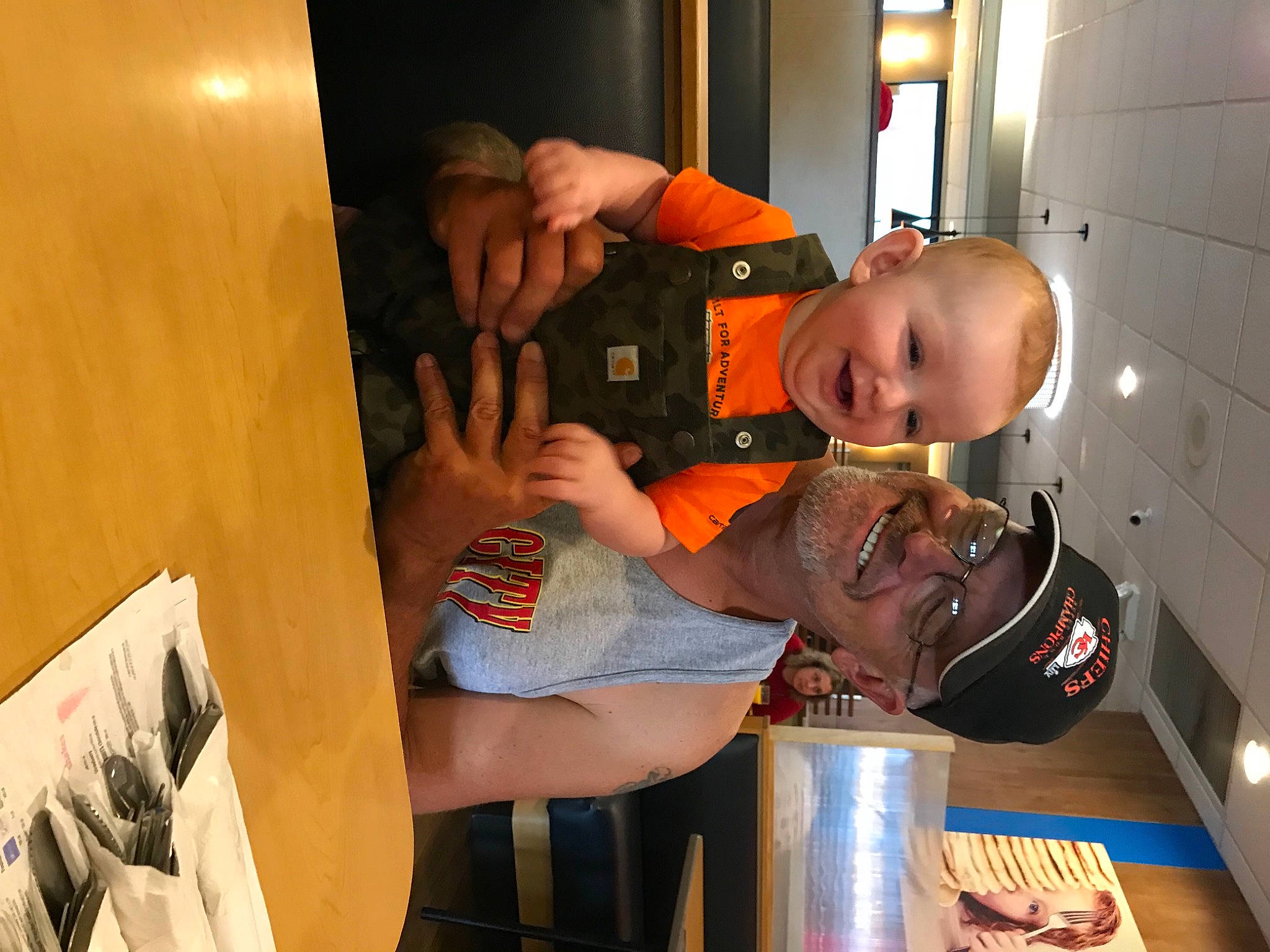 Jude joined the competition — help win amazing prizes! baby, child, drink, elbow, fun, hat, headwear, joy, orange, person, play, room, t_shirt, tableware, thigh, tin_can, toddler, wood