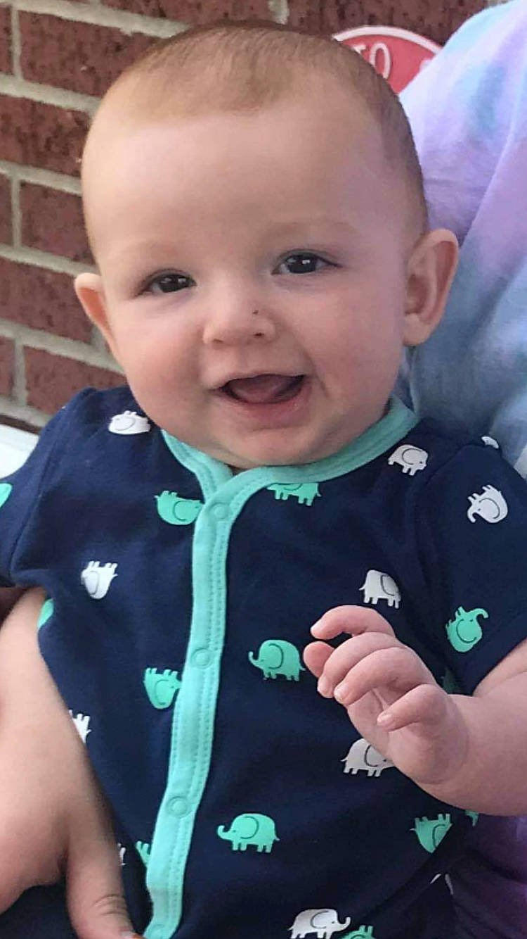 Jude joined the competition — help win amazing prizes! azure, baby_toddler_clothing, cheek, collar, face, facial_expression, finger, gesture, hand, happy, iris, nose, outerwear, person, pink, product, skin, sleeve, smile, standing