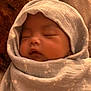 Anaiah is registered to the contest to win money with this photo: baby, sleeping, blanket, wrapped, cozy, infant, soft, pattern, face, closed_eyes, peaceful, newborn, cute, child, rest, warm, texture, portrait, indoors, head_covering