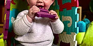 Athena participe au concours pour gagner de l'argent avec cette photo : baby, chewing, child, colorful, cozy, cute, face, floor, foam_puzzle, happy, home, indoor, leggings, person, play, puzzle_piece, sitting, smile, sock, toy