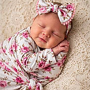 Kazmira is registered to the contest to win money with this photo: baby, blanket, bow, close_up, cream, crochet, floral, headband, infant, newborn, peaceful, photography, pink, portrait, rose, sleeping, smiling, studio, swaddle, textile