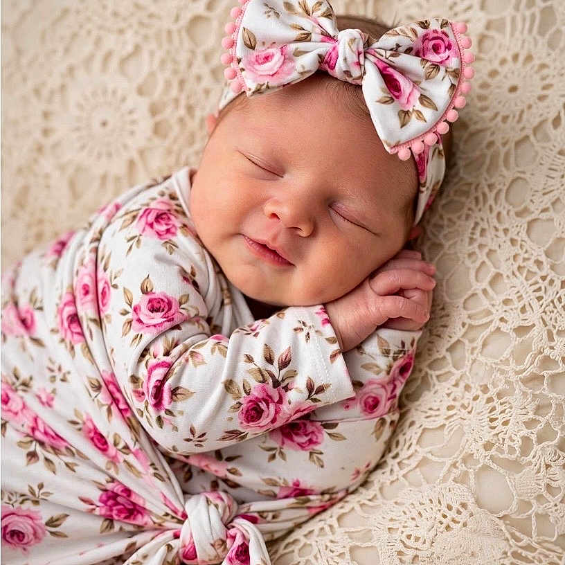 Kazmira is registered to the contest to win money with this photo: baby, blanket, bow, close_up, cream, crochet, floral, headband, infant, newborn, peaceful, photography, pink, portrait, rose, sleeping, smiling, studio, swaddle, textile