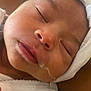 Mattea participe au concours pour gagner de l'argent avec cette photo : baby, cheek, close_up, cute, drool, eyelashes, face, head_wrap, human, infant, mouth, newborn, nose, peaceful, portrait, resting, skin, sleeping, soft_texture, white_clothing