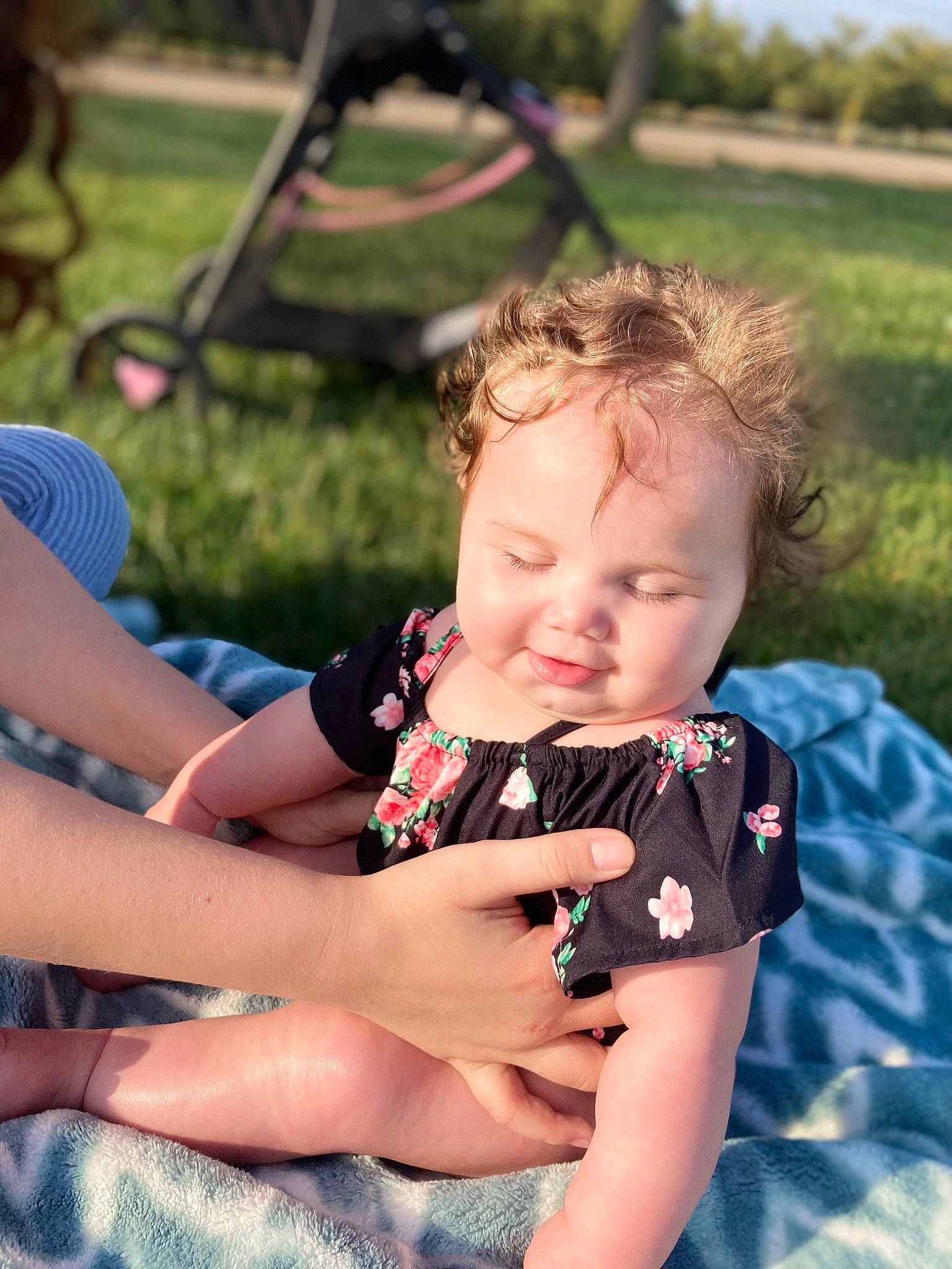Ariyah joined the competition — help win amazing prizes! baby, baby_toddler_clothing, blond, child, fun, grass, happy, human_leg, leisure, mammal, pattern, person, recreation, sitting, skin, spring, summer, thigh, toddler, tree
