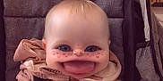Aria is registered to the contest to win money with this photo: baby, stroller, child, face_filter, heart_shapes, pink_jacket, seatbelt, indoor, cute, smile, hand, blond_hair, infant, playful, cartoon_effect, expression, seated, clothing, babyhood, adorable