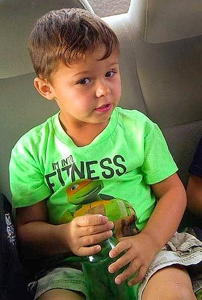 Peyton is registered to the contest to win money with this photo: arm, baby, child, leg, person, play, sitting, smile, t_shirt, toddler