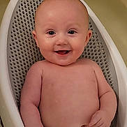 Ariya joined the competition — help win amazing prizes! baby, smiling, infant, child, bath, bathroom, seat, yellow_towel, happy, skin, face, cute, water, sitting, baby_skin, head, eyes, mouth, young_child, indoor