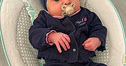 Jade participe au concours pour gagner de l'argent avec cette photo : awake, baby, bouncer_seat, bow, child, close_up, clothing, cozy, eyes, hands, headband, indoor, infant, newborn, nursery, pacifier, polka_dot, portrait, sitting, soft_fabric