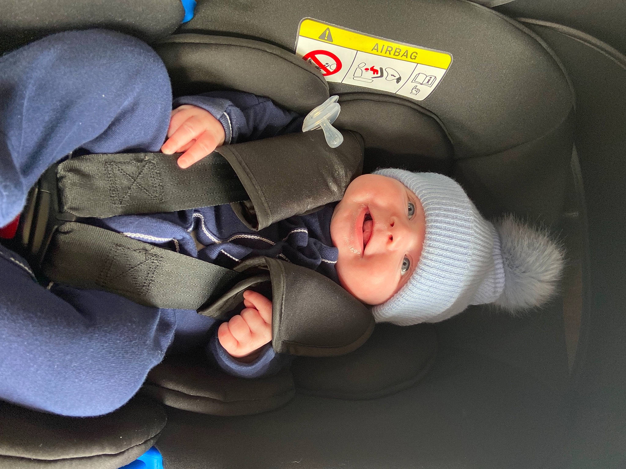Danny is registered to the contest to win money with this photo: auto_part, baby, baby_carriage, baby_in_car_seat, baby_products, baby_safety, baby_toddler_clothing, car_seat, child, comfort, headwear, lap, nap, person, sitting, sleep, toddler