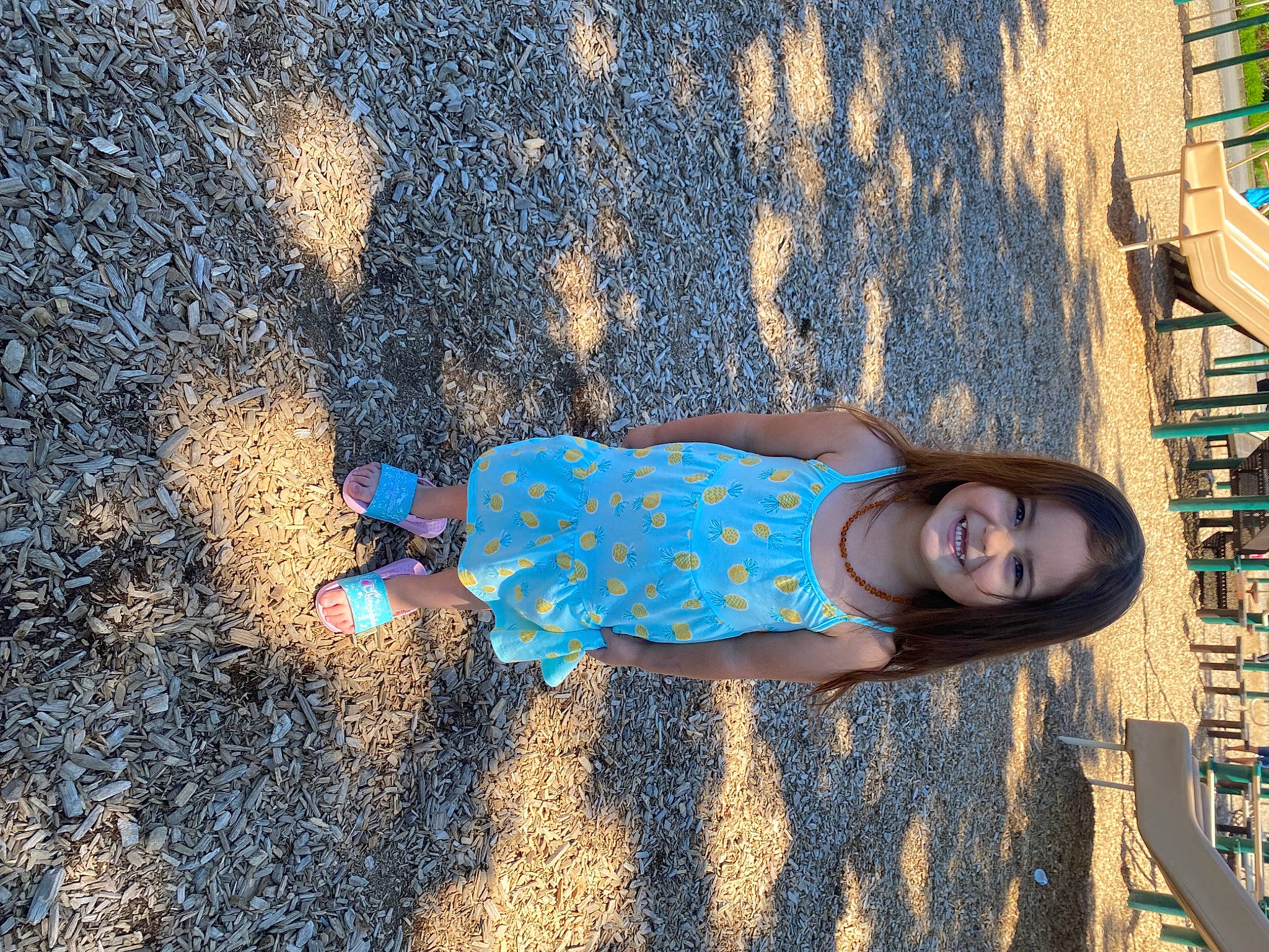 Jayde is registered to the contest to win money with this photo: asphalt, azure, dress, electric_blue, fun, glasses, grass, human_body, human_leg, joy, pattern, people_in_nature, person, road_surface, sand, sidewalk, sunglasses, tints_and_shades, toddler, tree