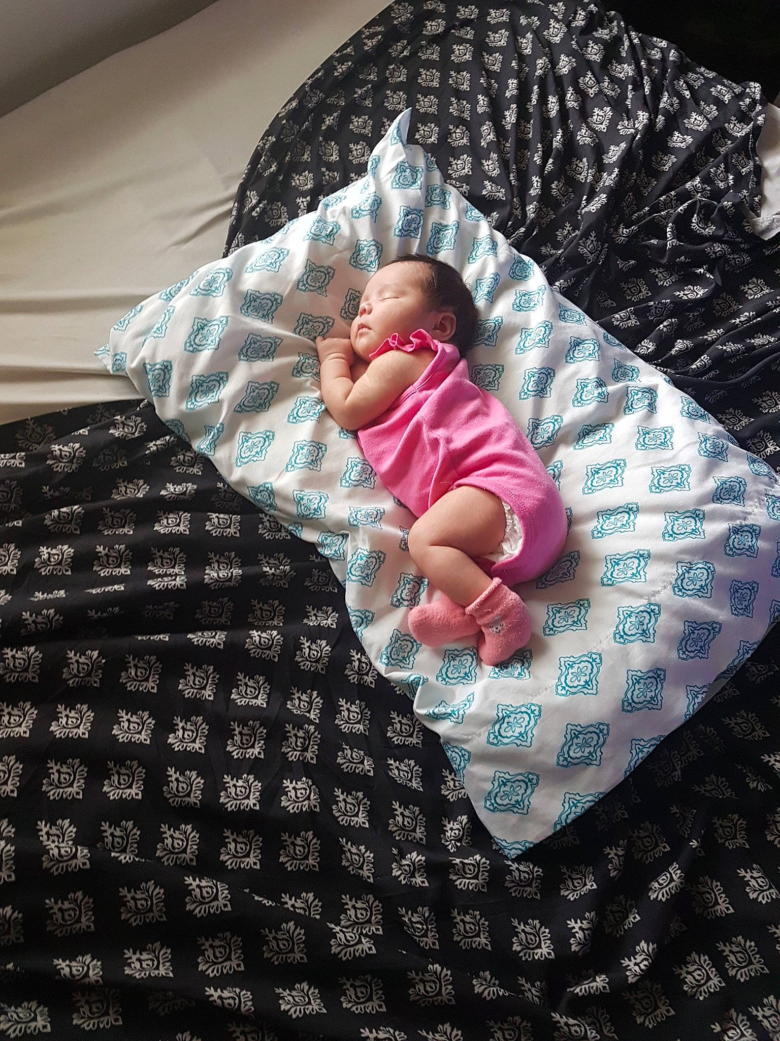 Cassie is registered to the contest to win money with this photo: baby, baby_sleeping, bed_sheet, bedding, bedtime, blanket, child, comfort, furniture, linens, nap, person, pink, product, sleep, textile, toddler