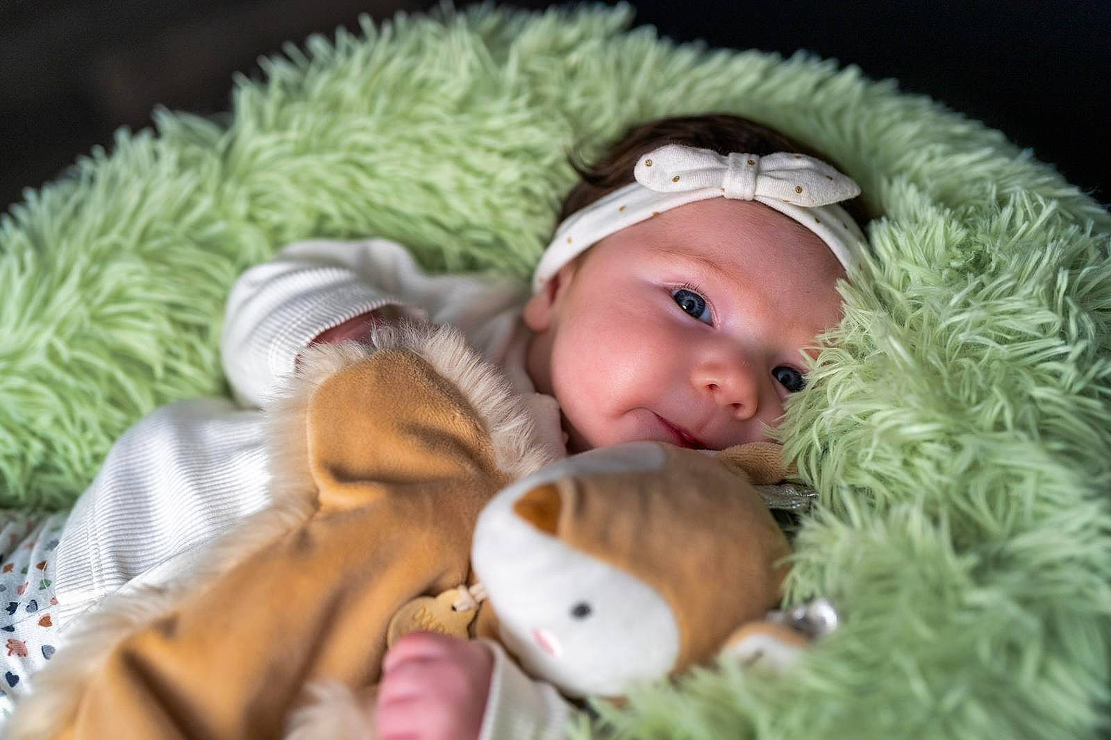 Elfie participe au concours pour gagner de l'argent avec cette photo : baby, baby_toddler_clothing, cheek, child, comfort, eye, facial_expression, finger, fur, grass, happy, head, headgear, headwear, iris, knit_cap, linens, mammal, person, skin