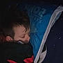 Elijah is registered to the contest to win money with this photo: child, sleeping, blanket, pillow, bedtime, cozy, indoor, dark, rest, face, head, person, young, peaceful, comfort, soft, hair, closed_eyes, relaxation, night