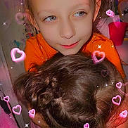 Luna is registered to the contest to win money with this photo: child, hug, heart_effect, sparkles, love, friendship, indoor, portrait, happy, affection, closeup, orange_clothing, pink_clothing, hair, face, hands, warmth, cute, together, smile