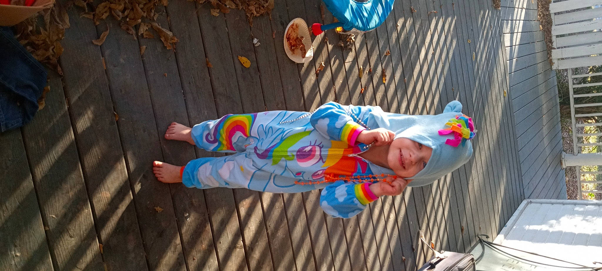 Luna joined the competition — help win amazing prizes! art, child, costume, flooring, foot, fun, hardwood, hat, headwear, human_leg, joy, leisure, orange, pattern, person, sandal, sunglasses, thigh, tree, visual_arts