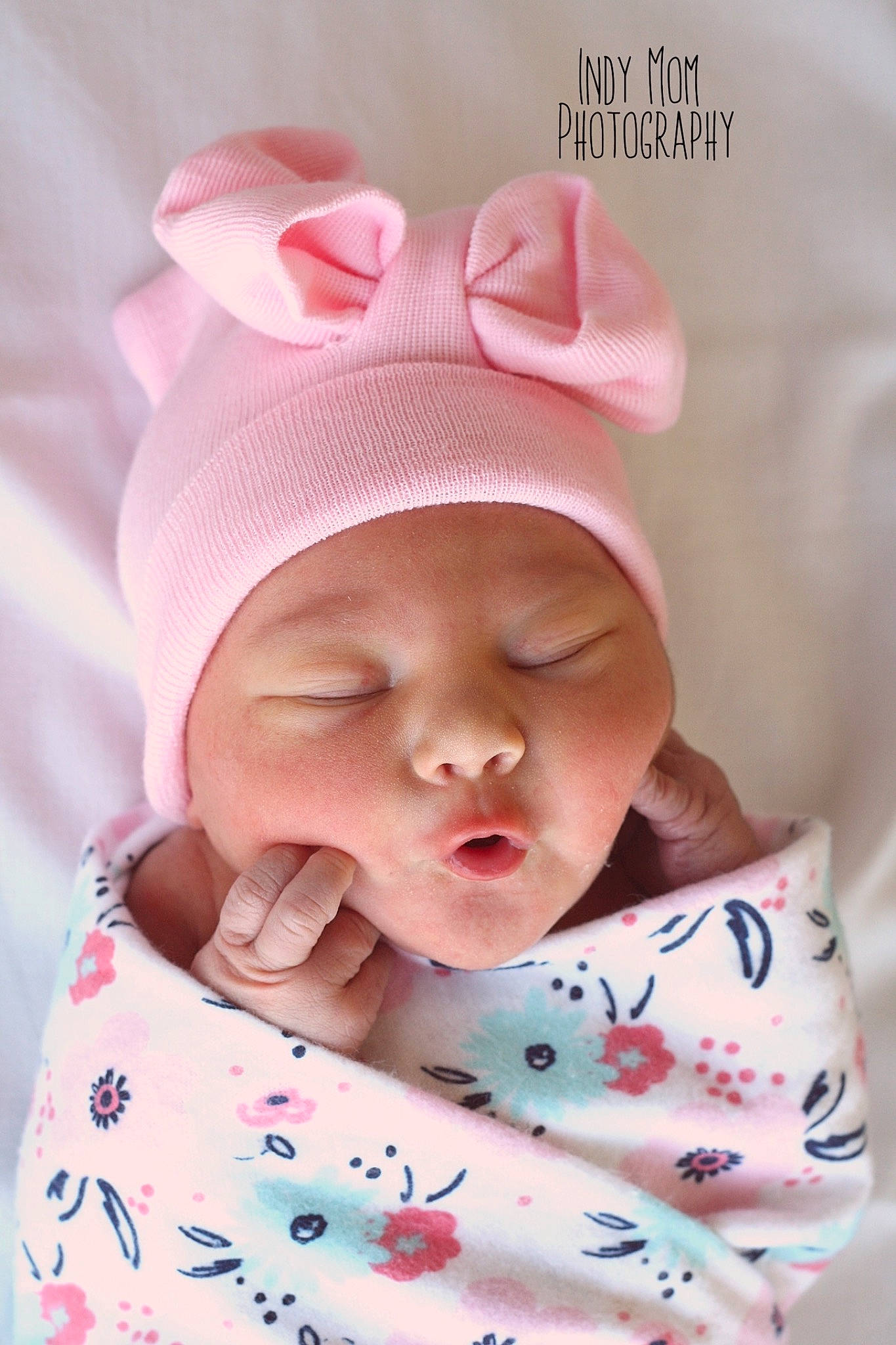 Lainey is registered to the contest to win money with this photo: baby, baby_sleeping, beanie, birth, bonnet, cap, cheek, child, hair_accessory, head, headgear, person, pink, skin, textile, toddler