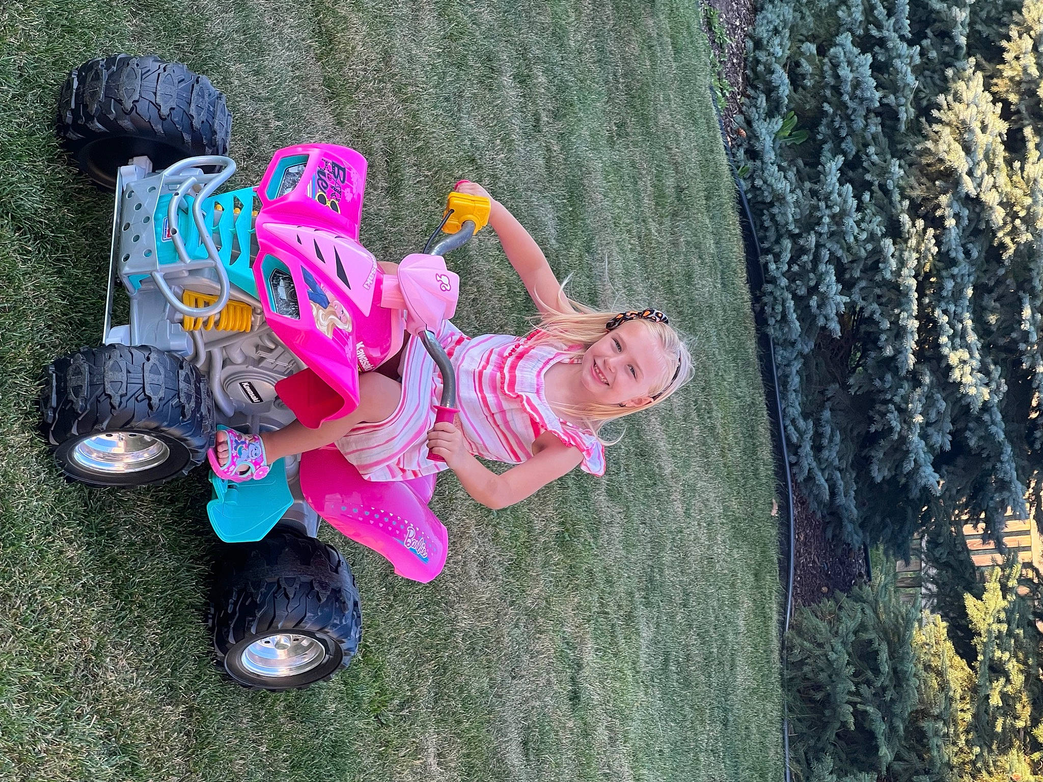 Diana is registered to the contest to win money with this photo: boot, child, footwear, fun, grass, happy, joy, leaf, leg, leisure, nature, organism, people_in_nature, person, pink, plant, recreation, shoe, smile, sneakers