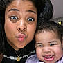 Triana joined the competition — help win amazing prizes! woman, child, toddler, smile, funny_face, indoor, close_up, portrait, happy, face, person, black_hair, jewelry, necklace, casual_clothing, cute, playful, family, love, together