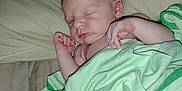 Chase is registered to the contest to win money with this photo: baby, newborn, sleeping, blanket, pillow, bed, infant, peaceful, soft, cozy, skin, hand, face, rest, comfort, indoors, person, cute, wrapped, toddler