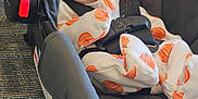 Avacyn joined the competition — help win amazing prizes! baby, baby_clothes, black_car_seat, car_seat, carpet, child, clothing, curious, cute, fabric, indoor, infant, orange_hat, person, pumpkin_pattern, seatbelt, sitting, small_child, soft, wide_eyes