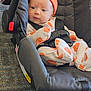 Avacyn joined the competition — help win amazing prizes! baby, infant, car_seat, orange_hat, pumpkin_pattern, clothing, seatbelt, black_car_seat, carpet, indoor, cute, child, person, sitting, wide_eyes, curious, fabric, baby_clothes, small_child, soft