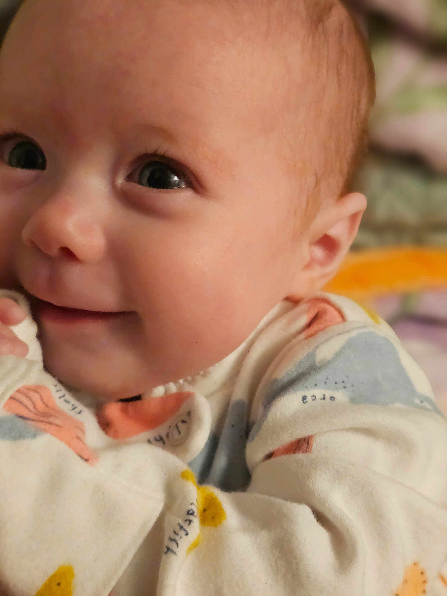 Avacyn joined the competition — help win amazing prizes! baby, cheeks, child, close_up, cozy, cute, eyes, face, happy, indoor, infant, newborn, onesie, patterned_clothing, portrait, skin, small_hands, smile, soft_lighting, warmth