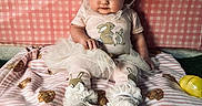Briley joined the competition — help win amazing prizes! baby, bow, bunny, child, cute, dress, easter_eggs, furniture, girl, pink, plush, portrait, sitting, sock, soft_toy, striped_blanket, teddy_bear, toddler, toy, white