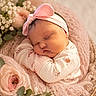 Kora is registered to the contest to win money with this photo: baby, newborn, sleeping, pink, headband, bow, blanket, basket, flower, floral, soft, cute, infant, peaceful, portrait, wrapped, cozy, closeup, child, adorable