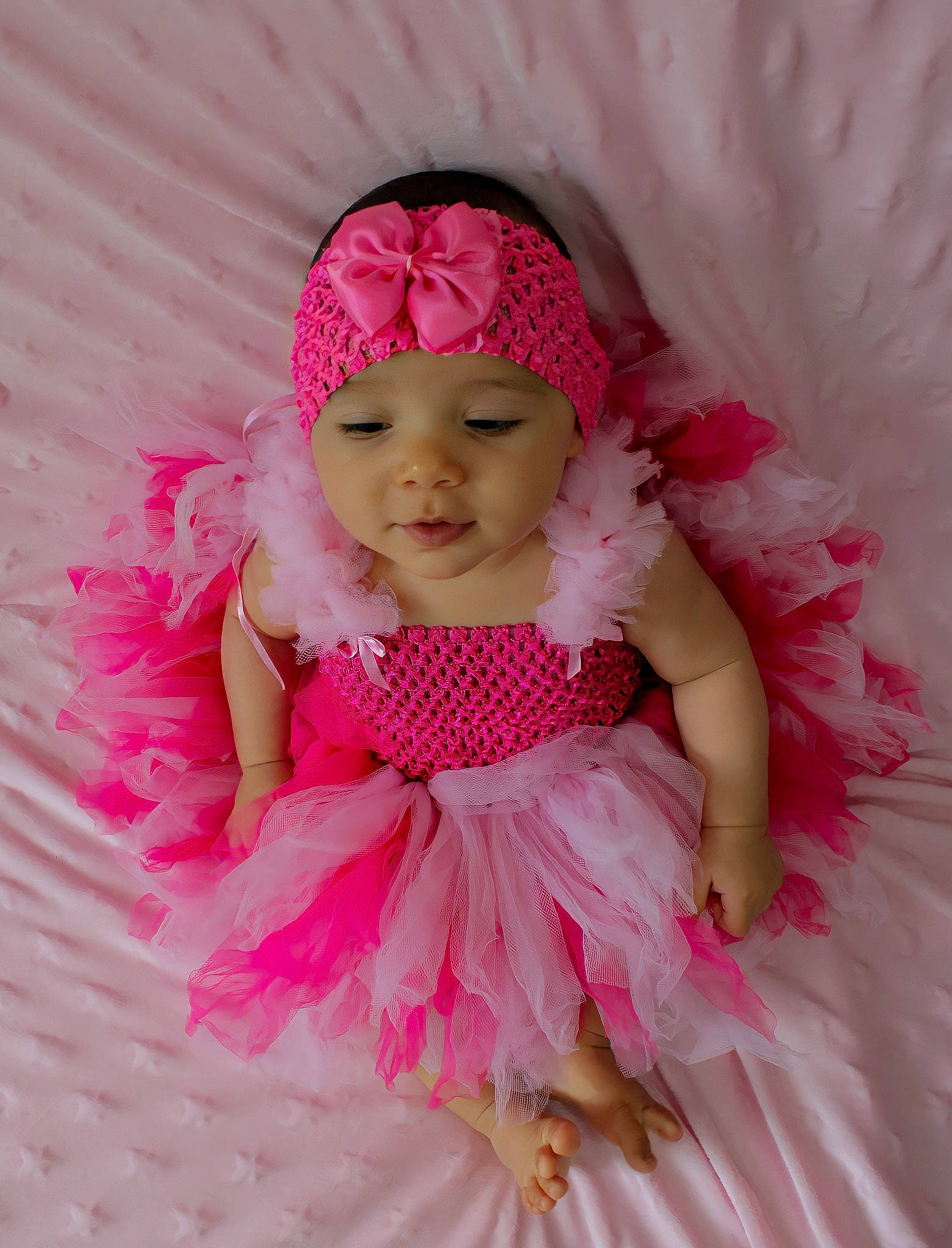 Hayden participe au concours pour gagner de l'argent avec cette photo : baby, baby_products, baby_toddler_clothing, child, dress, embellishment, eye, happy, head, headband, headpiece, headwear, magenta, pattern, peach, person, petal, pink, ruffle, sleeve